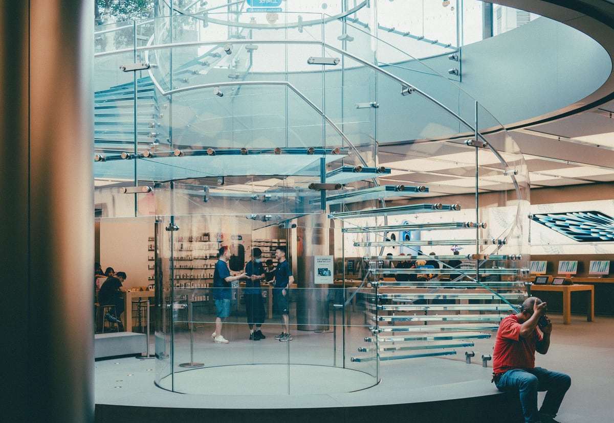 Glass retail staircase and customer area representing customer experience in technical strategy