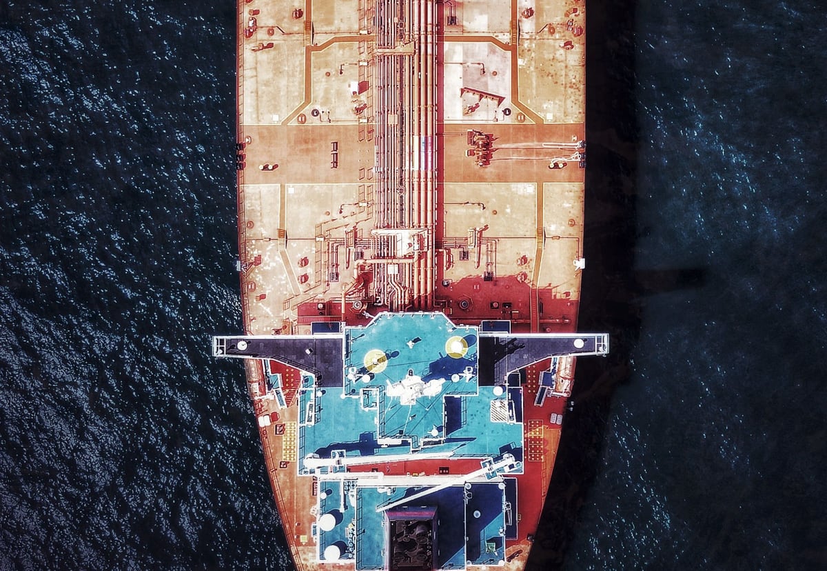 Overhead view of a cargo ship representing delivery momentum and technical debt trade-offs