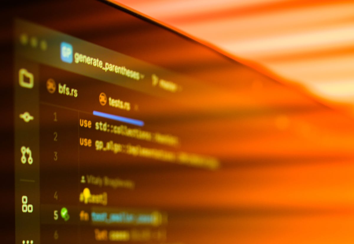 Warm close-up of a code editor representing practical technical roadmap decisions
